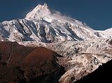 Manaslu 08 03 Manaslu Early Morning From Beyond Sama As I walked towards Samdo, I turned and caught another view of Manaslu with the Manaslu Icefall tumbling down. The normal climbing route is to the right of the glacier, and then up the long ridge going right to left.